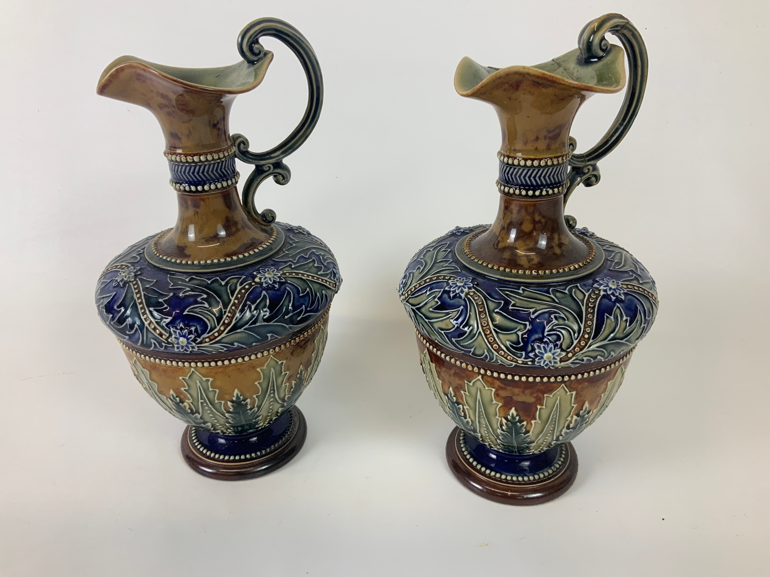 Pair of Doulton Ewers - Damage to One