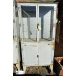 A Medical Display Cabinet, comprising lower storage cupboard, glazed display drawer and top