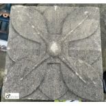 A reconstituted stone Wall Plaque depicting a flower, 9in x 9in