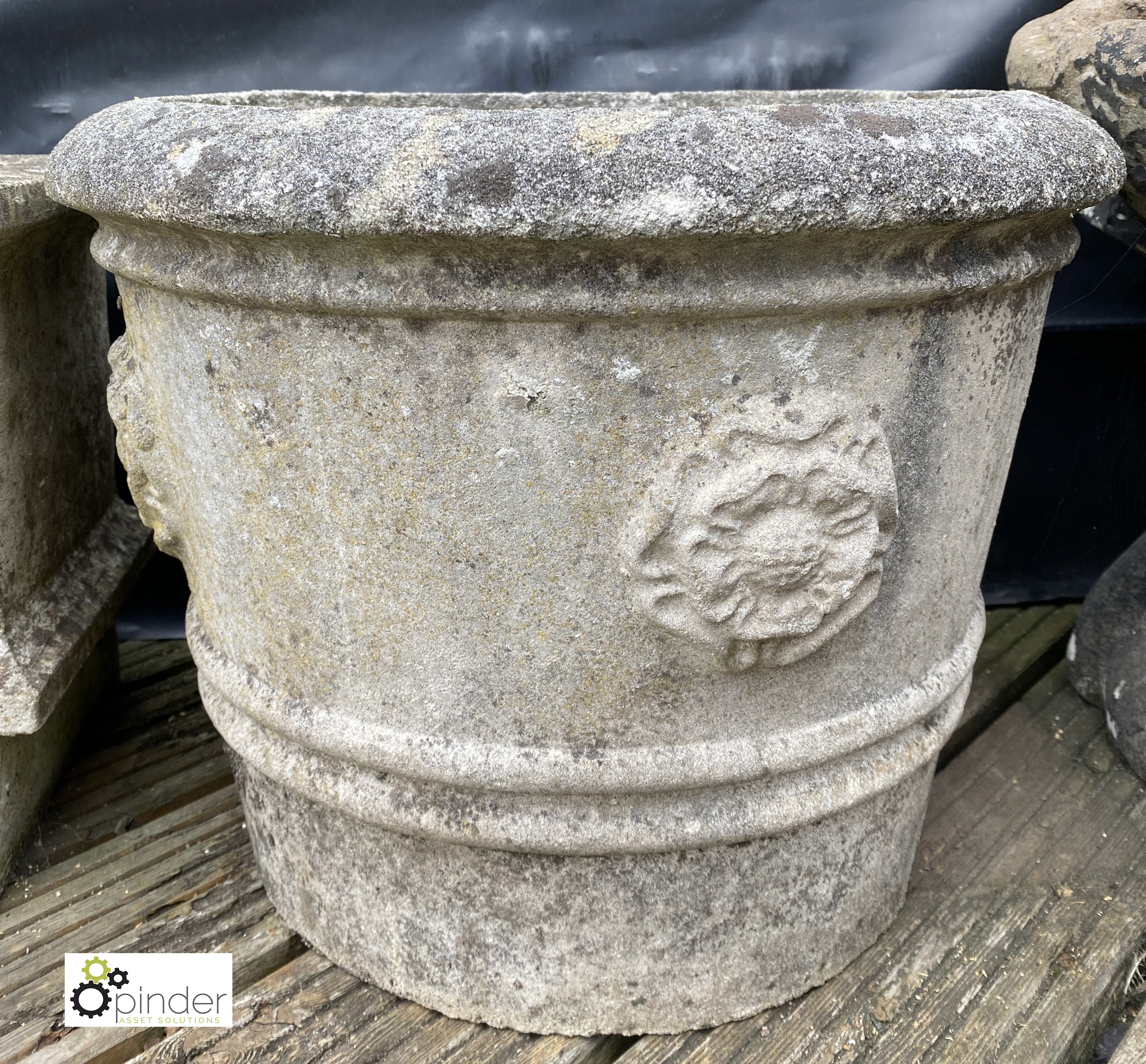 A round reconstituted stone Planter, with rose motif decoration, 12in high x 17in diameter