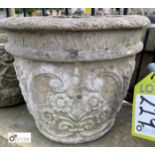 A reconstituted stone Planter, with flower decoration, 12in high x 14in diameter