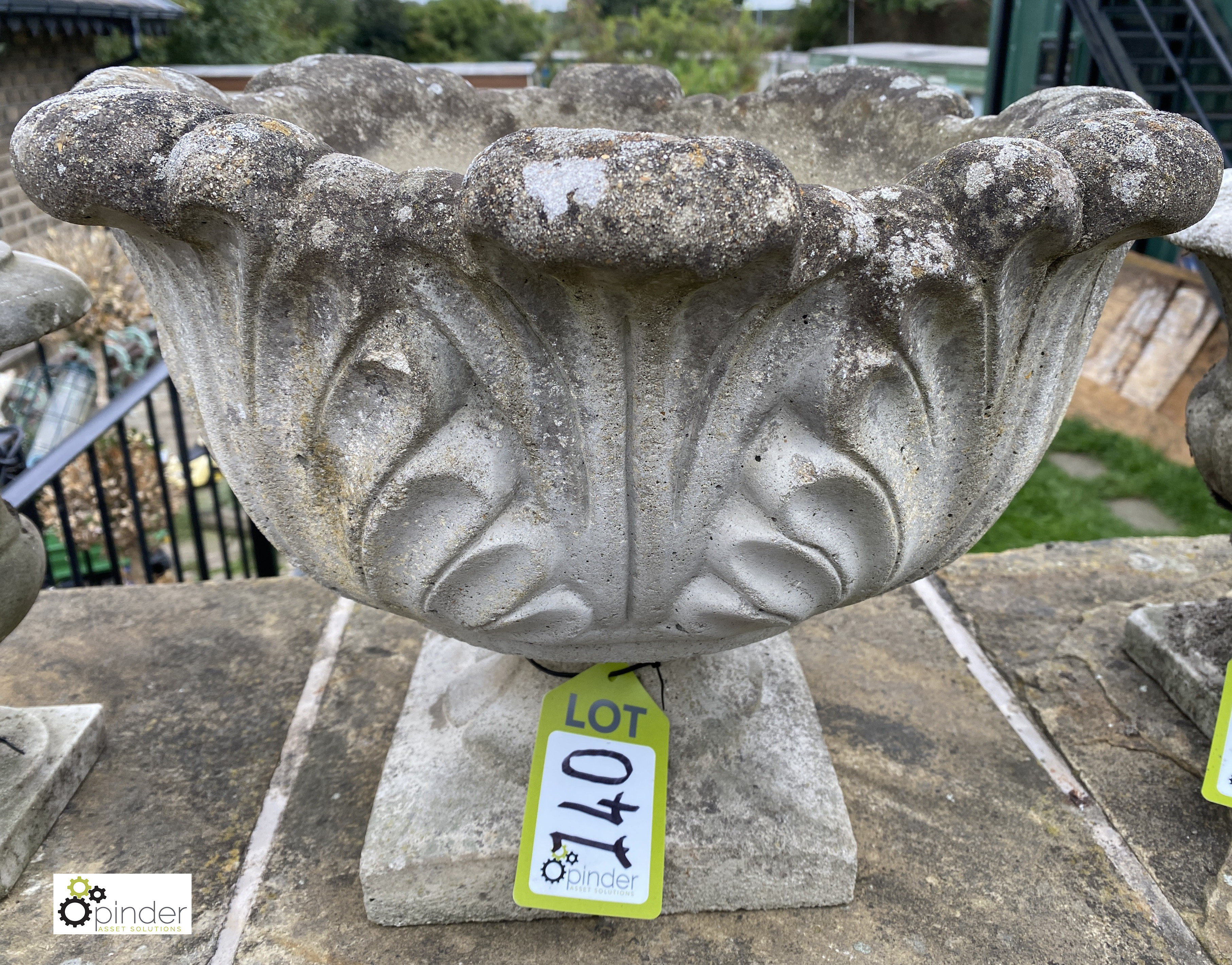 A reconstituted stone Urn, with acanthus leaf decoration, circa late 1900s, 14in high x 19in