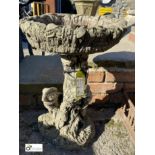 A reconstituted stone Bird Bath, faux bois style with decoration of children playing, 25in high x