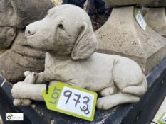 A reconstituted stone Statue of a puppy holding a bone, 9in high x 15in long