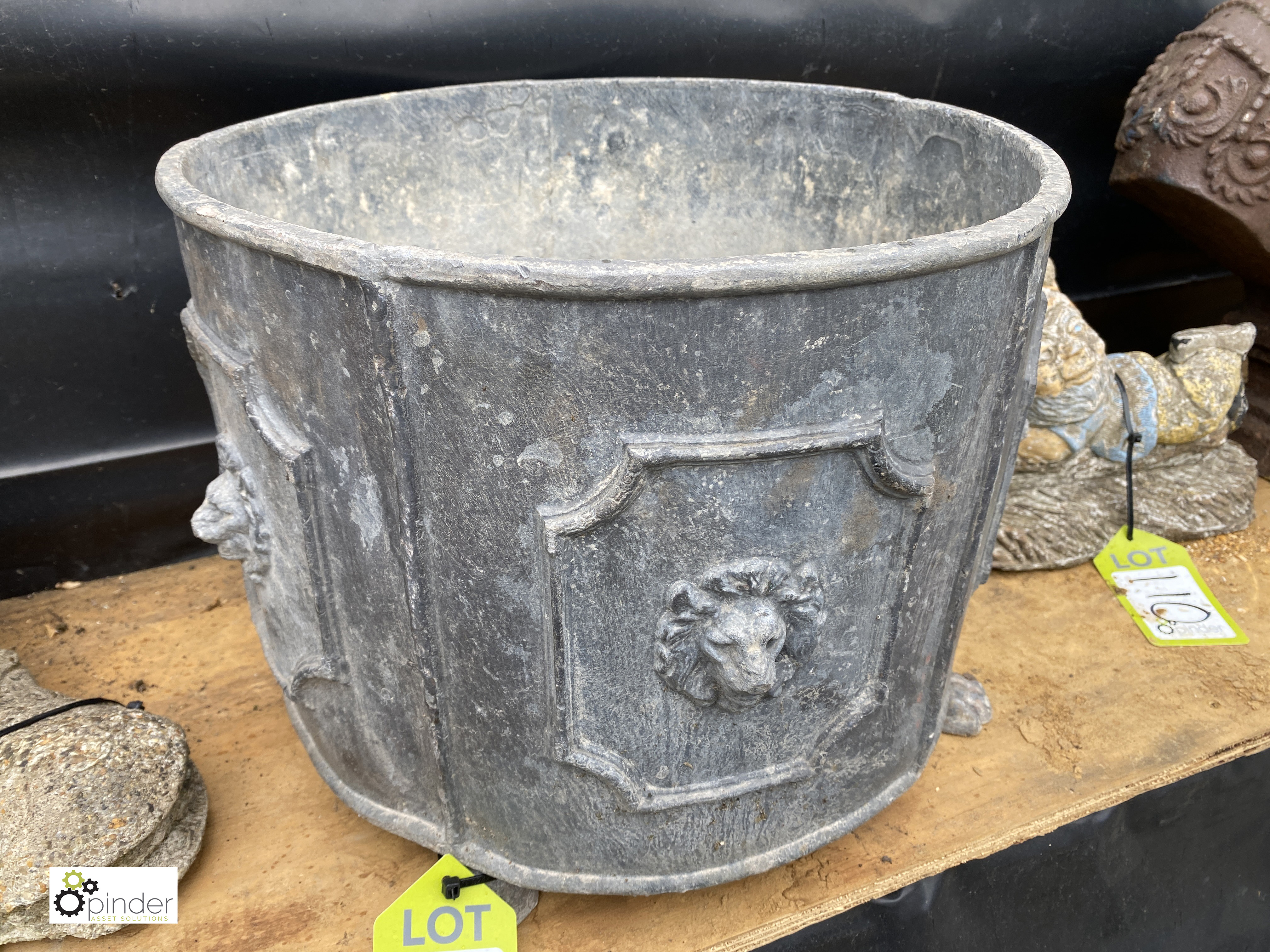 An Edwardian style round lead Planter, with lion’s paw bracket feet, 14in high x 16in diameter