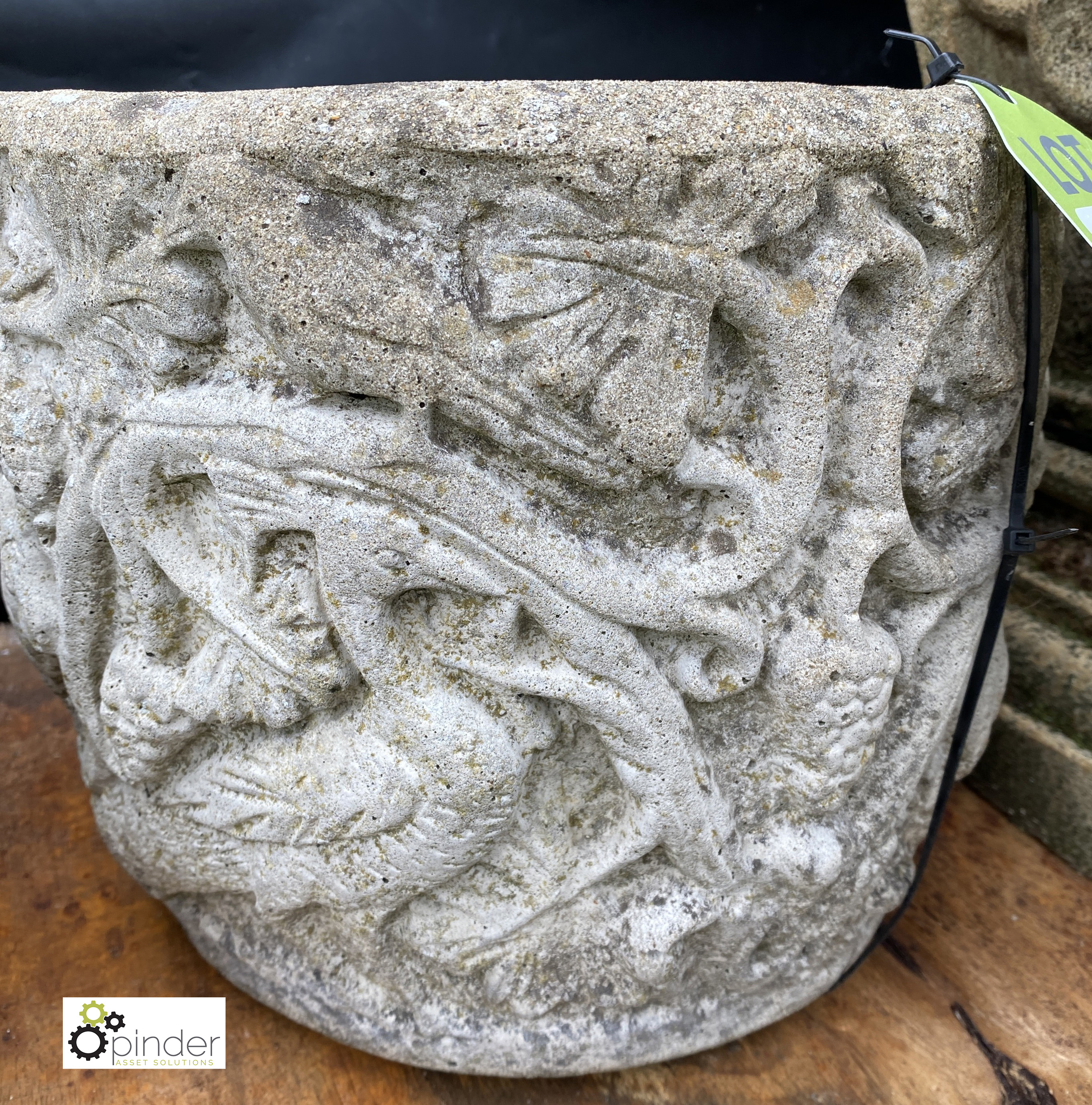 A reconstituted stone Planter, depicting mythical creature design, in the style of William De