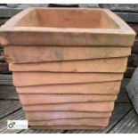 A red square terracotta Planter, with ribbed decoration, 18in high x 16in x 16in