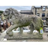 A reconstituted stone lion leaning his paw upon an embroidered ball Statue, representing supremacy