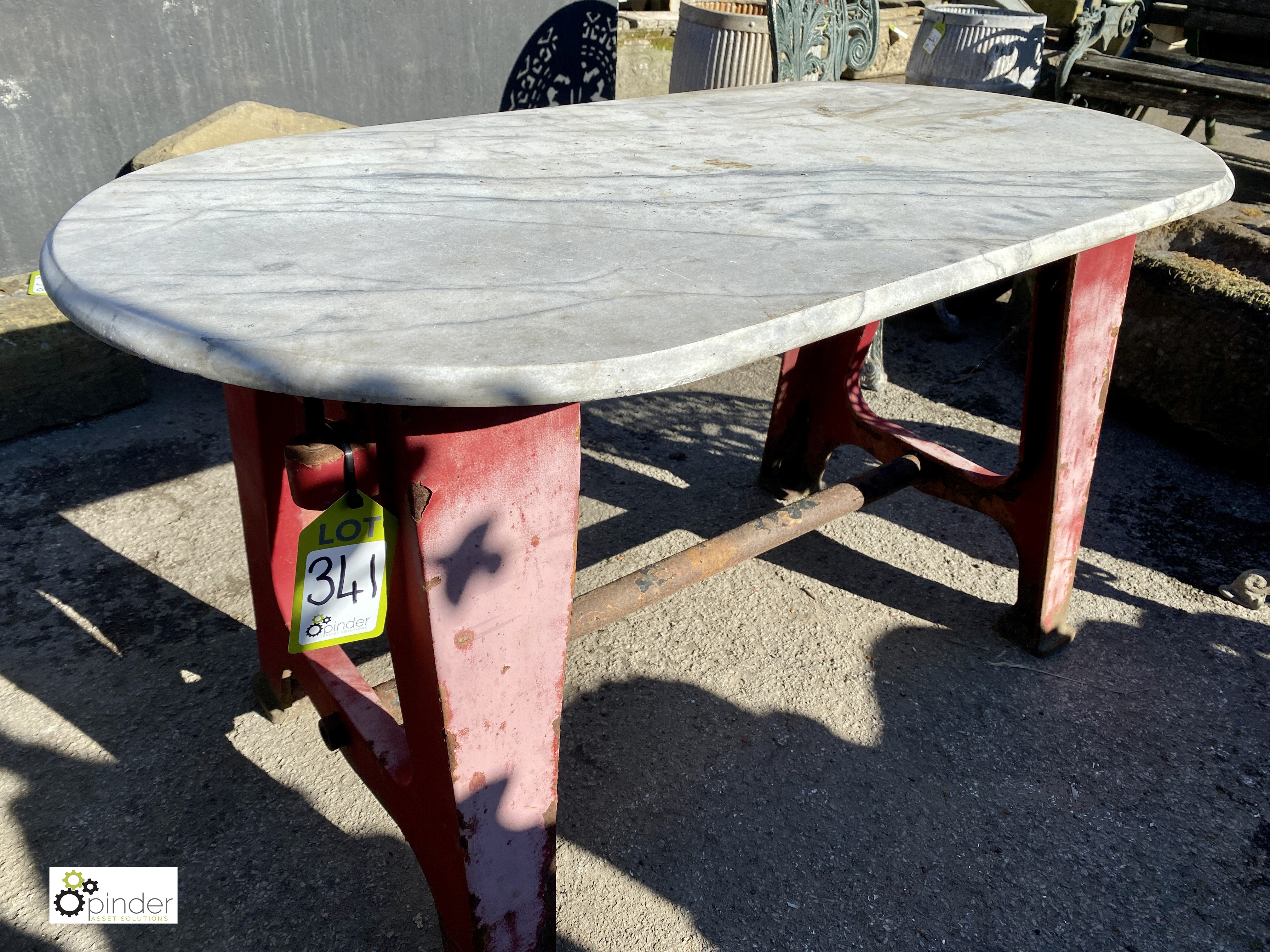 An industrial cast iron Table Base, with an oval shaped Carrera marble top, 24in high x 24in wide