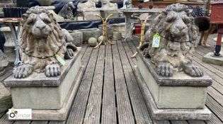 A pair reconstituted stone recumbent Statues of roaring lions, on rectangular plinths, 35in high x