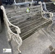A wooden and cast Garden Bench, with decorative cast ends, 32in high x 48in wide