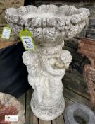 A reconstituted marble Jardiniere of 3 Putto holding an acanthus leaf bowl, 38in high x 20in