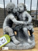 An original lead Statue of a young boy and girl kissing, circa 1900s, 14in high