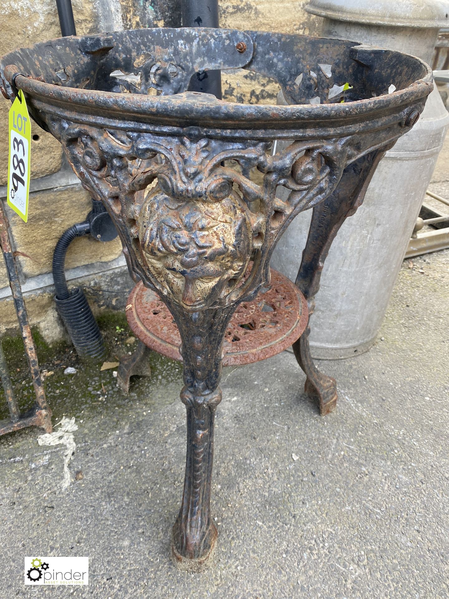 A decorative cast iron Pub Table Base, with girls face decoration, 26in high x 20in diameter