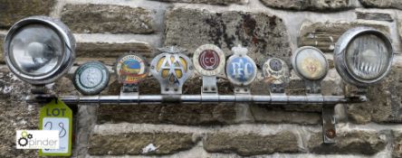 A vintage chrome Light and Badge Bar, 12in high x 32in wide, complete with 7 historic badges