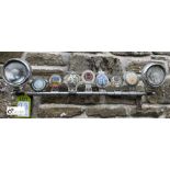 A vintage chrome Light and Badge Bar, 12in high x 32in wide, complete with 7 historic badges