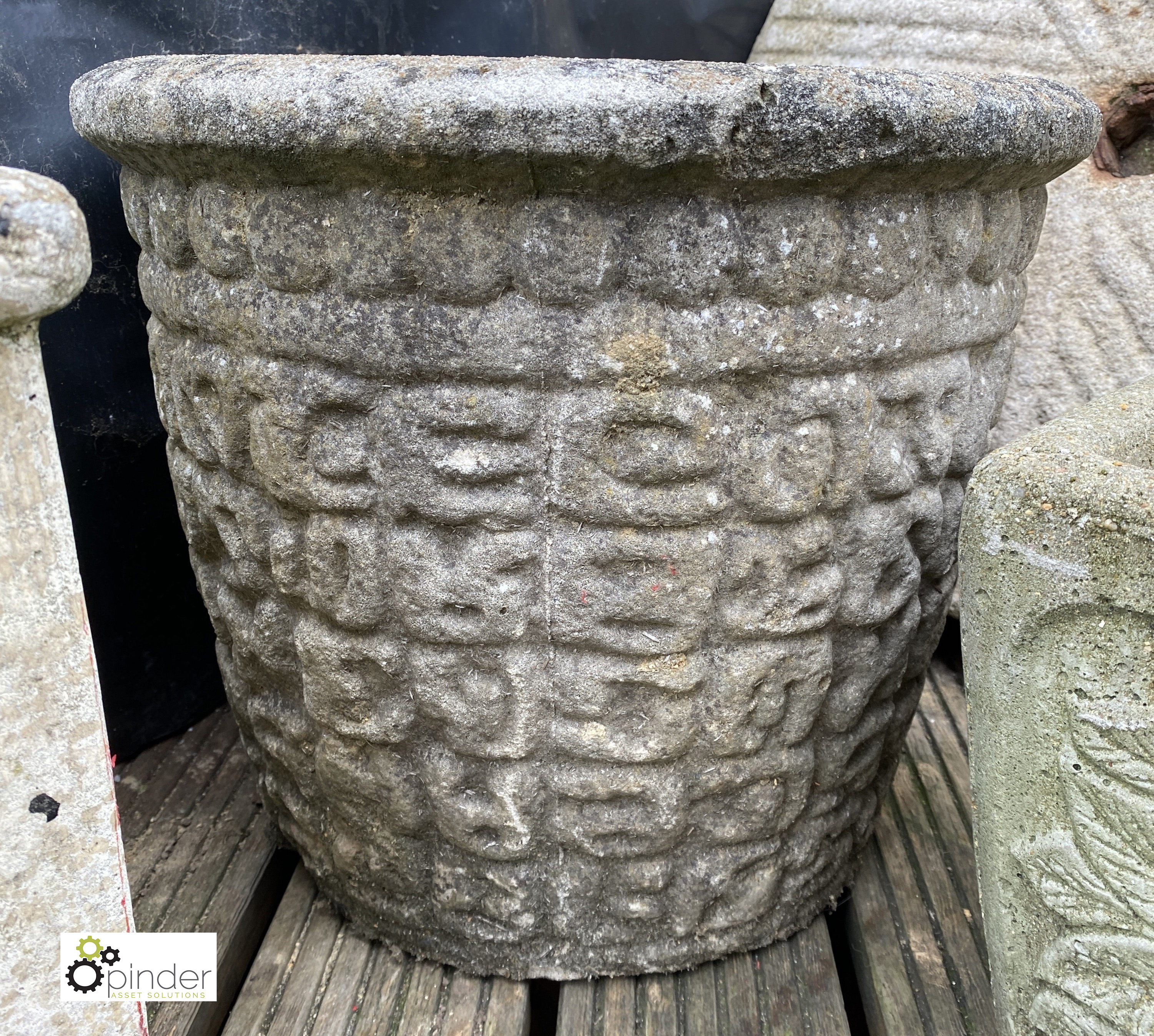 A round reconstituted stone Garden Planter, with rustic pattern, 14in high x 17in diameter