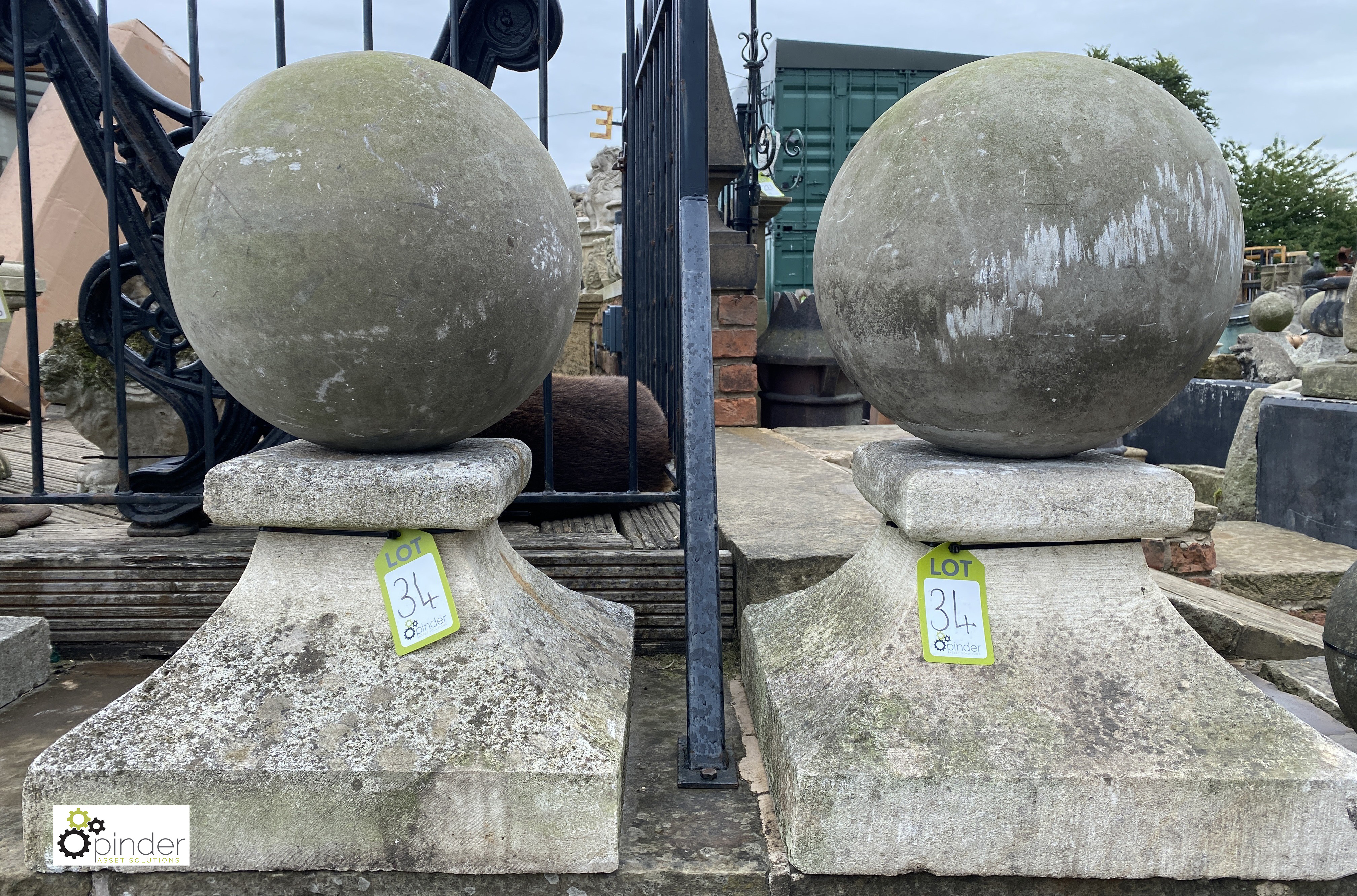 A pair antique original carved Stone Balls on plinths, ball diameter 16in, 29in high with base, 19in