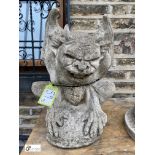 A reconstituted stone Seated Gargoyle, 23in high