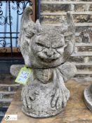 A reconstituted stone Seated Gargoyle, 23in high