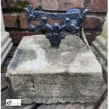 A Victorian cast iron Boot Scraper, on Yorkshire Stone base, 10in high, base 10in x 10in