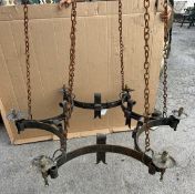 A vintage wrought iron Chandelier with scroll decoration, 10in high x 44in diameter