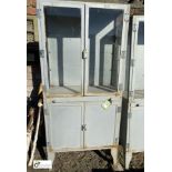 A Medical Display Cabinet, comprising lower storage cupboard, glazed display drawer and top