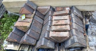 Approx. 45 reclaimed triangular red Coping Bricks