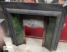 A cast iron Fireplace Insert, with green insert enamelled tiles, 970mm high x 970mm wide