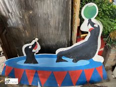 A painted wooden board of 2 Sea Lions playing, 1170mm high x 1140mm long