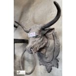 A cast iron wall mounted bulls head with horns Tethering Ring, 240mm high x 270mm wide