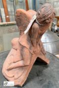 A clay Finial of a winged angel/cherub, 90° pitch angle, 310mm high x 250mm wide x 280mm long