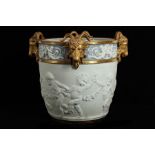 A LARGE LATE 19TH CENTURY SEVRES STYLE BISCUIT PORCELAIN AND PARCEL GILT JARDINIERE