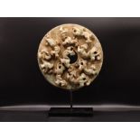 Chinese Hardstone Carved Wheel Depicting Mythical Beasts