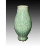A CHINESE CARVED CELADON VASE, MING DYNASTY