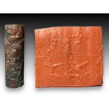 A WESTERN ASIATIC DOUBLE REGISTER CYLINDER SEAL INSCRIBED WITH CUNEIFORM