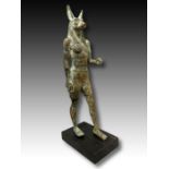 AN EGYPTIAN BRONZE ANUBIS LATE PERIOD, DYNASTY XXVI-XXX, 664-343 B.C.