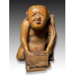 A WOOD NETSUKE DEPICTING A RAT CATCHER, MEIJI PERIOD