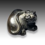 A WOOD NETSUKE OF A TIGER, MEIJI PERIOD