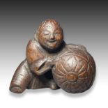 A WOOD NETSUKE OF A BOY & A STRAW BOX, MEIJI PERIOD