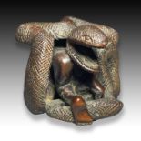 AN EROTIC SNAKE ENTANGLED LADY WOOD NETSUKE, MEIJI PERIOD, 19TH CENTURY