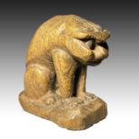 A WOOD NETSUKE DEPICTING A MYTHICAL BEAST, MEIJI PERIOD