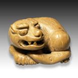 TAMETAKA: A NETSUKE DEPICTING A DOG, MEIJI PERIOD