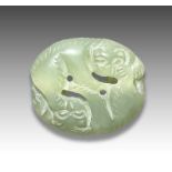 A JADE PENDANT OF TWO MYTHICAL BEASTS FIGHTING, QING DYNASTY (1644-1911)