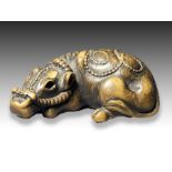 TOMOTADA: A WOOD NETSUKE OF A COW, MEIJI PERIOD