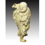 AN IVORY NETSUKE OF A GAMA SENNIN, MEIJI PERIOD