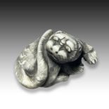 AN IVORY NETSUKE OF A TIGER, MEIJI PERIOD