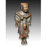 A WOOD NETSUKE OF A STREET VENDOR, MEIJI PERIOD