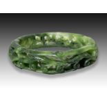 A SPINACH JADE CARVED BANGLE, LATE QING PERIOD