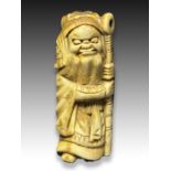 AN IVORY NETSUKE OF A SHOKI, MEIJI PERIOD